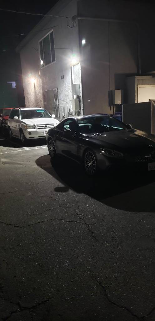 Three cars parked in two car stall at 1522 Hi Point St